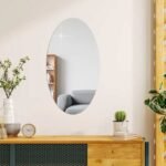 Oval adhesive mirror in living room