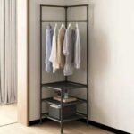 Corner clothes rack with coat hanger stand and three lower shelves.