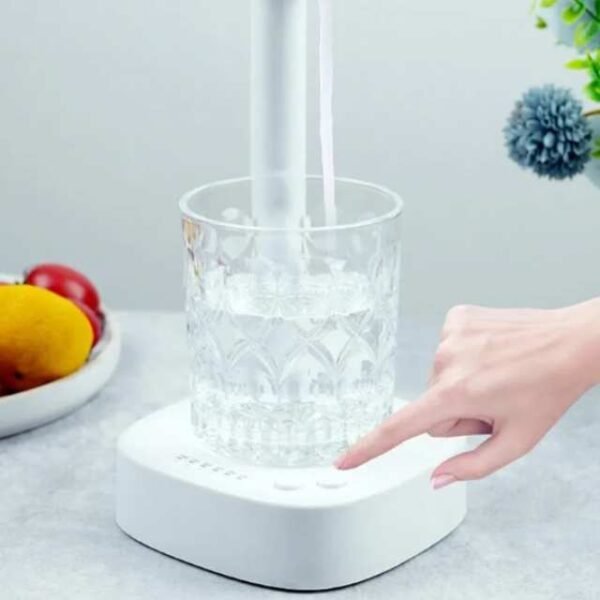 Desktop water dispenser with one-button operation.