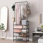 Large capacity single pole clothes rack with 5 shoe shelves for storage.