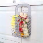Portable basket on kitchen counter holding kitchen ingredients.