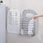 Portable laundry baskets in white and grey mounted on the wall.