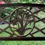 Elegant lattice floral design on steel garden bench.