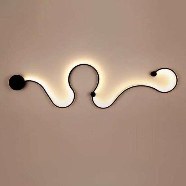 Curved wall light on a wall. Lights up with warm, beautiful light. Adds charm to decor.