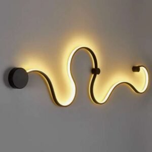 Curved wall light casting warm light. Creative Nordic wall lamp for modern home decor.