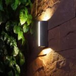Outdoor wall lights decorating garden walls and casting ambiance.