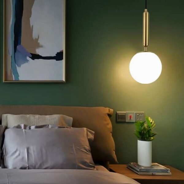 Nordic pendant light fixture in bedroom with warm light.