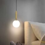 Modern Nordic pendant light fixture hanging from wall lighting bedroom.