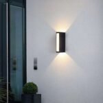Outdoor wall lights illuminating the night in building corridors.