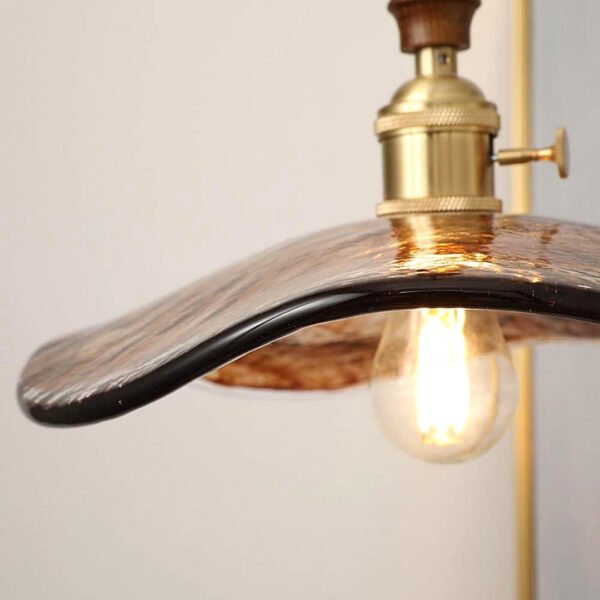 Close-up of vintage pendant light casting a warm, inviting glow.