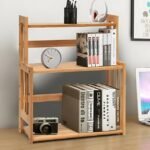 3-Tier bamboo organizer with books and bedroom accessories.