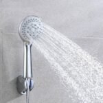 Shower head pouring water with high-pressure sprayer