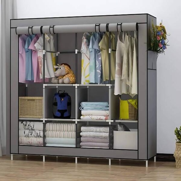 Portable large storage wardrobe in grey inside a bedroom for easy assembly.