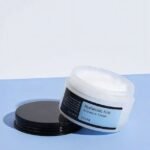 COSRX skin hydration cream with hyaluronic acid placed on table with generous 100g capacity.
