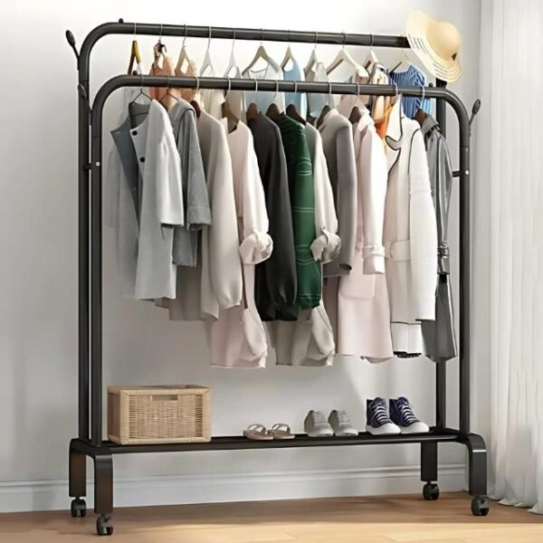 Double pole coat rack in a home setting for organizing clothes and shoes in black metal.