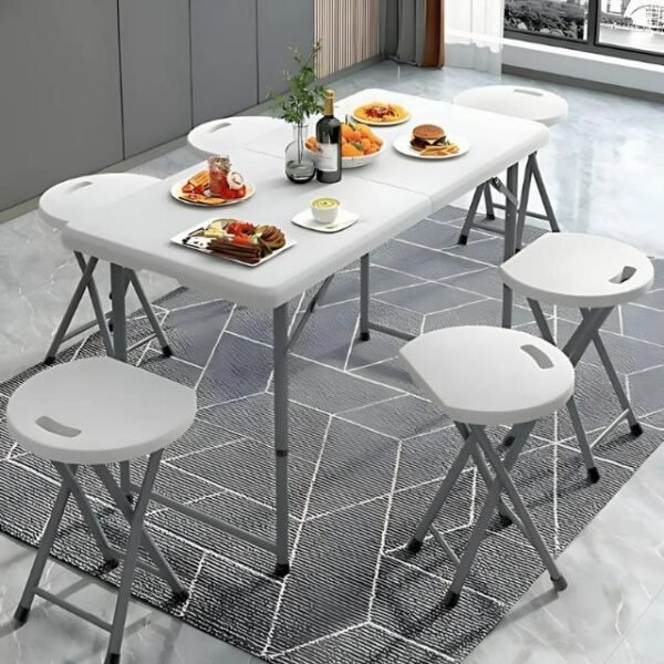 Folding dining table with adjustable height, placed in dining room.