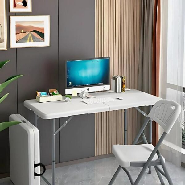 White folding study table in bedroom with computer.