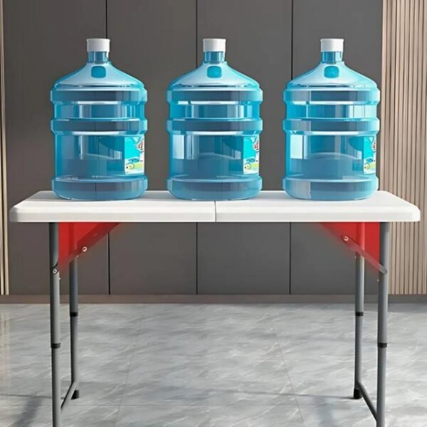 Heavy-duty folding table holding water gallons, showing durability.