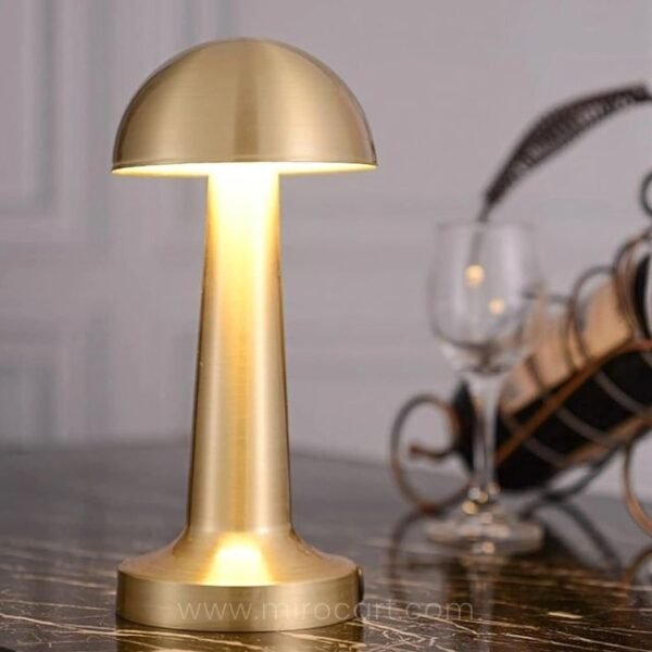 Warm mushroom table lamp next to wine rack for hosting atmosphere.