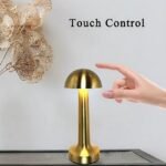 Woman adjusting brightness on the dimmable mushroom table lamp.