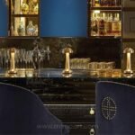 Dimmable mushroom table lamps on bar counter for enhanced experience.