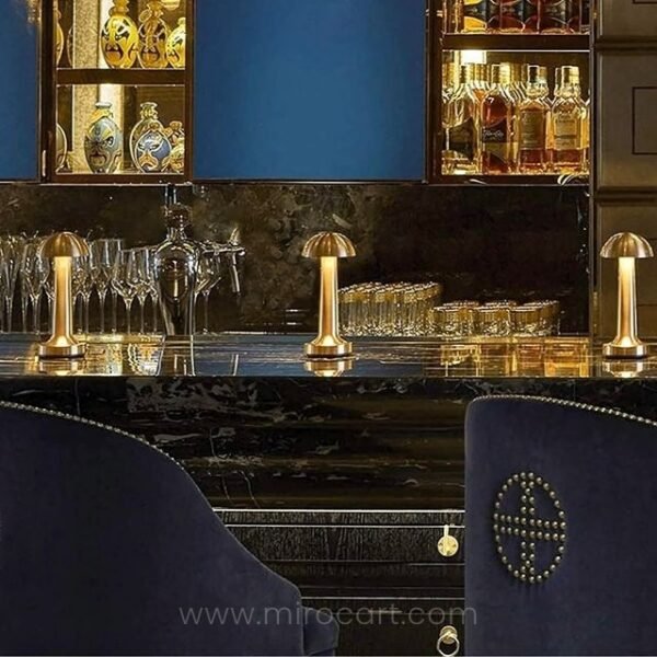 Dimmable mushroom table lamps on bar counter for enhanced experience.