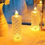 Crystal LED candle lamps with warm yellow light creating cozy ambiance with reflections.