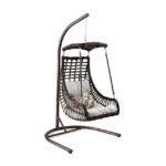 Hanging egg chair with cushion and handcrafted rattan design for relaxation.