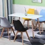 Vibrant modern dining chairs in a kitchen setting, around a table for dining and lounging.