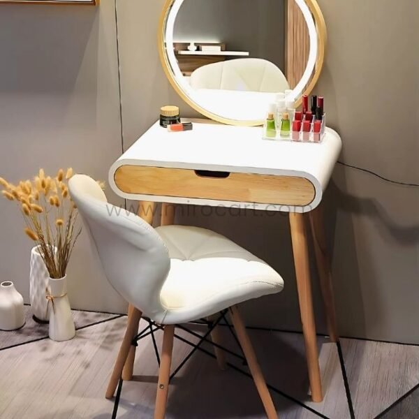Modern dressing table with round illuminated mirror and beauty products.