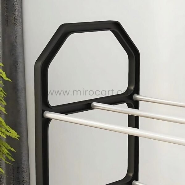Black drying rack with a pentagon-like geometric frame and three sturdy stainless steel bars for efficient hanging and drying.