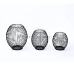 Three black spherical lanterns with geometric wire patterns.