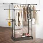 Neatly organized rack with clothes and shoes in a bright bedroom.