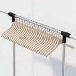 Wooden hangers evenly spaced on sturdy metal rod.