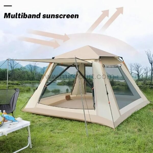 Automatic camping tent with a protective screen and multiband sunscreen feature near a lake and mountains.
