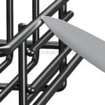 Knife cutting carbon steel rods to demonstrate the spice rack's sturdy construction.