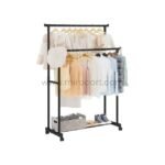 Black double pole clothes rack with two hanging rods and a bottom shelf storing shoes and accessories, offering a practical, space-saving design.