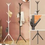 Close-up of black and white tree branch coat hangers showing 45° hooks and tripod bases.