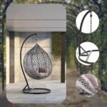 Close-up detail of premium woven PE rattan and black powder-coated steel frame on hanging egg chair