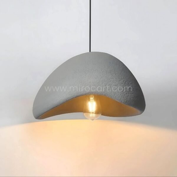 A Creative Wabi-Sabi Pendant Lamp adds warmth and sophistication to a modern kitchen, enhancing its sleek design.