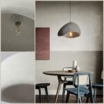 A Creative Wabi-Sabi Pendant Lamp adds warmth and sophistication to a modern dining area, enhancing its sleek aesthetic.