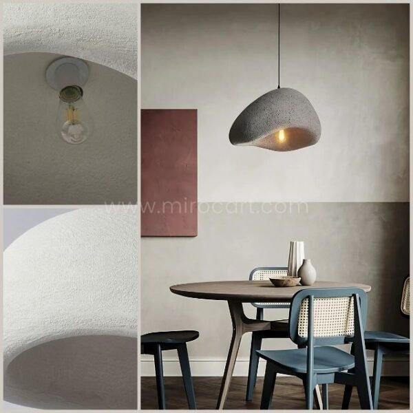 A Creative Wabi-Sabi Pendant Lamp adds warmth and sophistication to a modern dining area, enhancing its sleek aesthetic.