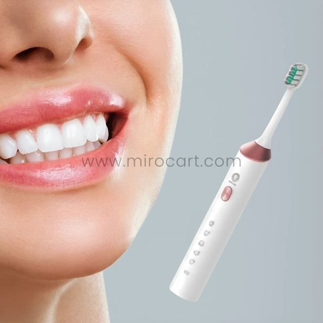 A close-up of a bright white smile next to the Green Lion electric toothbrush showcasing its effectiveness in achieving optimal oral hygiene.