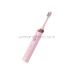 The vibrant pink Green Lion electric toothbrush showcased with a rose gold grip accent for a chic feminine appeal.