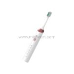 The white Green Lion electric toothbrush showcased with a minimalist aesthetic featuring a pink grip and green bristles.