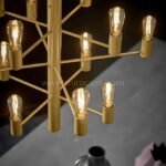 A detailed close-up of the chandelier, showcasing its intricate craftsmanship and warm illumination.