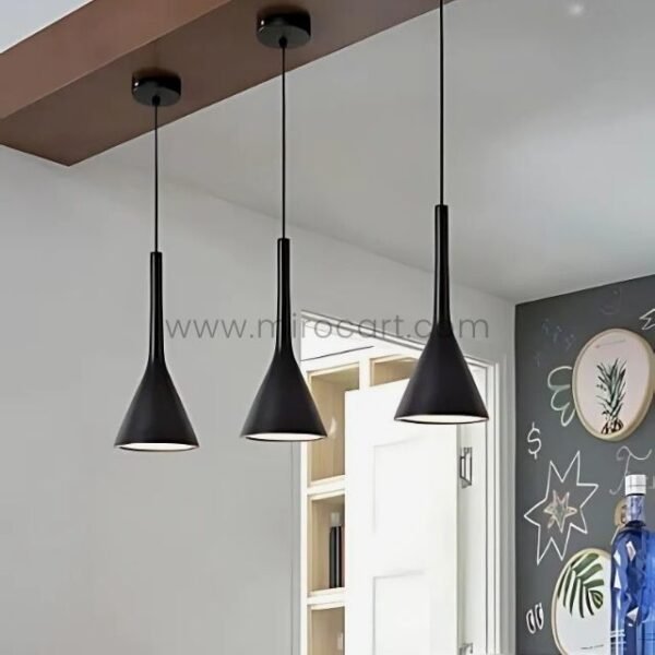 Three Nordic Cone Pendant Lamps in black hanging over a chalkboard wall in a modern kitchen setting.