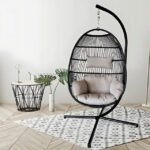 Premium Hanging Egg Chair with a sleek black frame and cushioned seat, placed on a stylish rug in a minimalist living room setting.