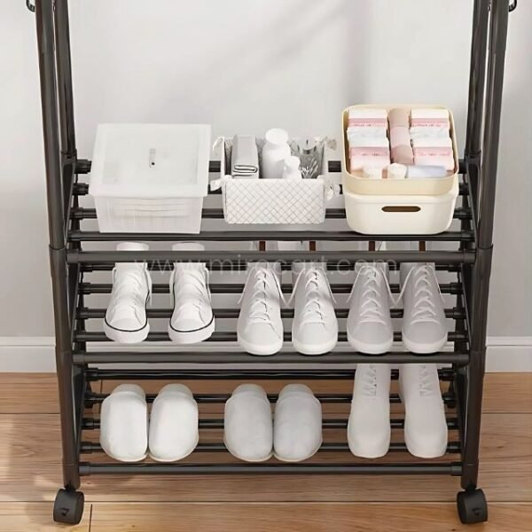 Neatly arranged shoes and storage bins on the lower shelves of the space-saving clothes & shoe rack.
