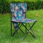 Colorful floral camping chair outdoors.